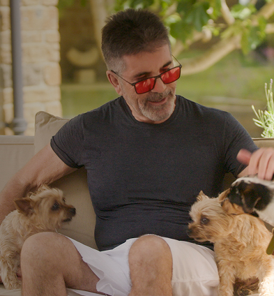 Simon and his dogs on the couch