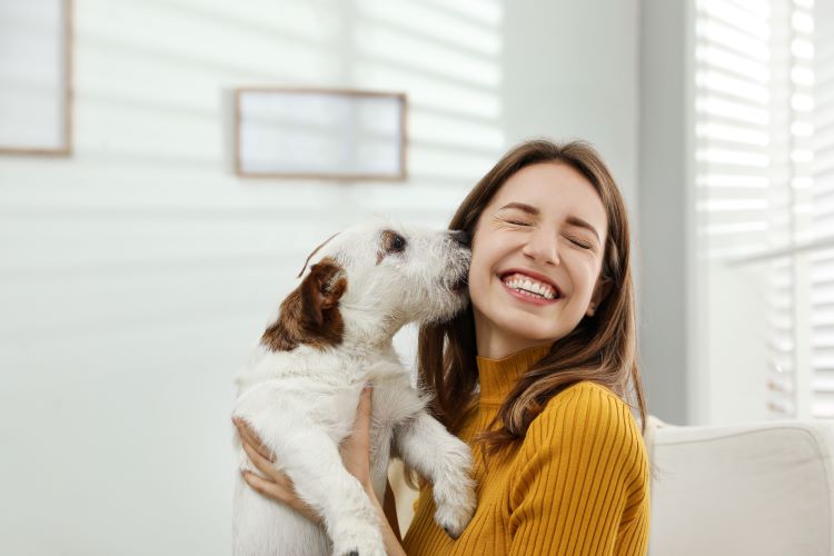 girl-holding-dog-smiling